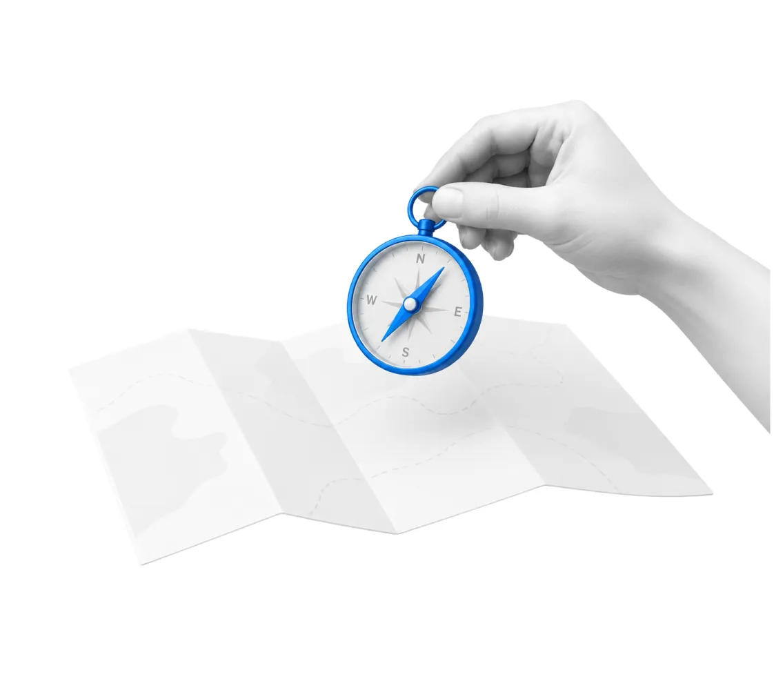 A hand holding a compass over an unfolded map